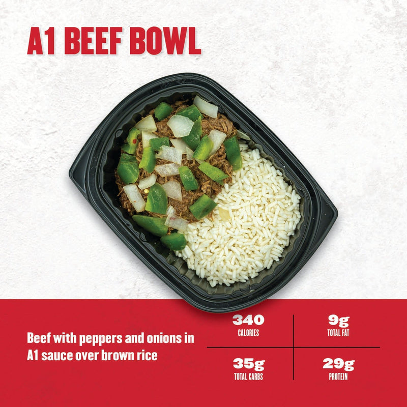 “A1 Beef Bowl – shredded beef sautéed with green peppers and onions, served over brown rice in a black meal prep container from Clean Eatz Kitchen.”