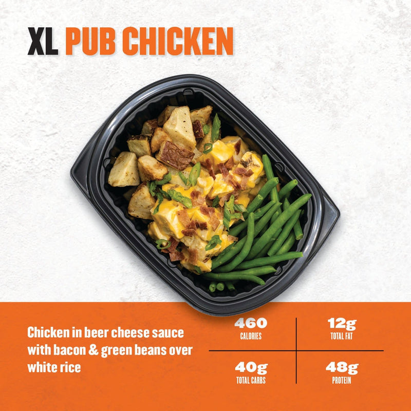 XL Pub Chicken – roasted chicken with beer cheese sauce, bacon bits, diced potatoes, and green beans in a black meal container.