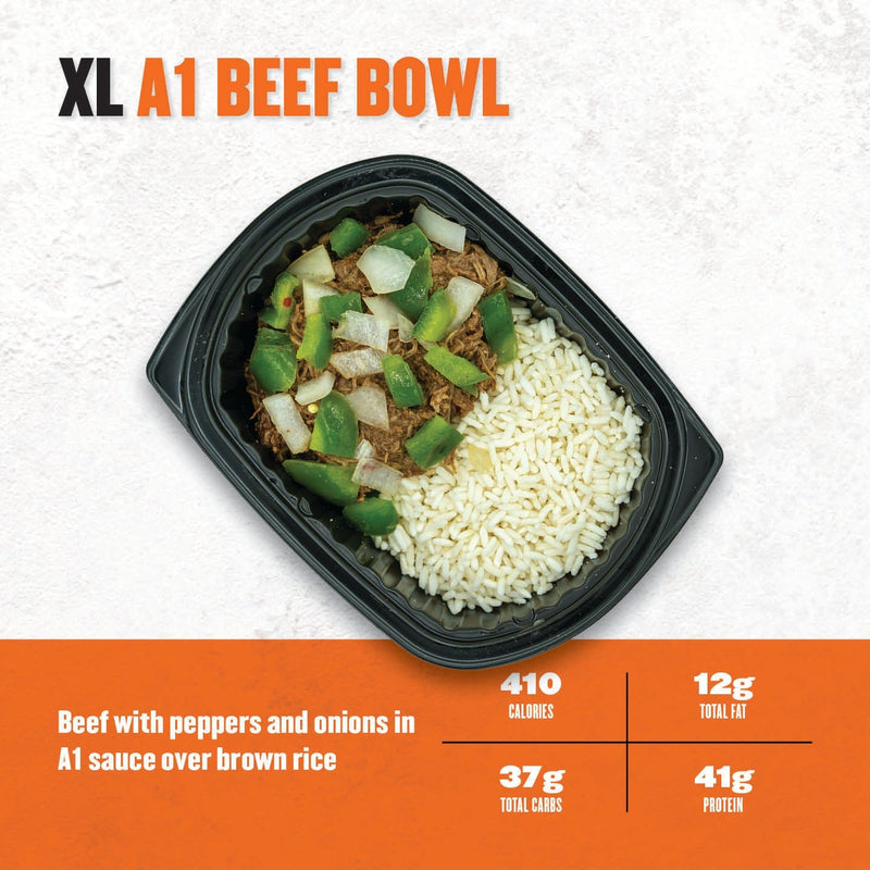 XL A1 Beef Bowl – shredded beef topped with green peppers and onions in A1 sauce, served with brown rice in a black microwaveable tray.
