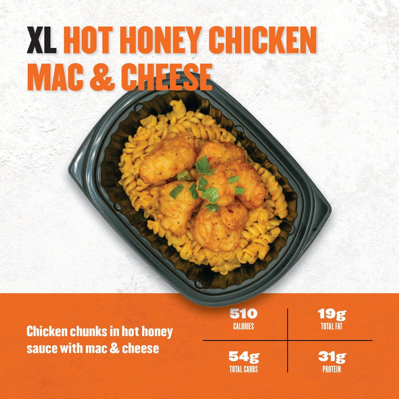 XL Hot Honey Chicken Mac & Cheese – crispy chicken chunks drizzled with hot honey sauce over creamy macaroni and cheese in a black container.