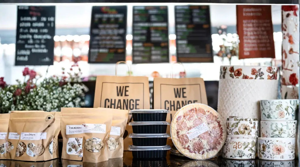 Express meal delivery café counter with packaged meals, wraps, and branded containers