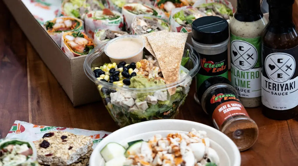 Gluten-free dish salad with whole grain wrap and condiment selection displayed