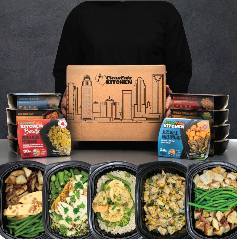 Clean Eatz Kitchen Weight Loss Meal Plan entrees in labeled trays, each printed with calories and macros, ready for the freezer