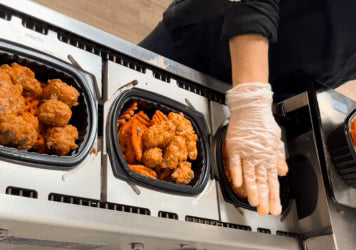 Clean Eatz Kitchen meals being produced.