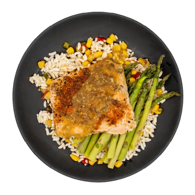 Salmon with asparagus over rice, corn, and peppers on a black plate.