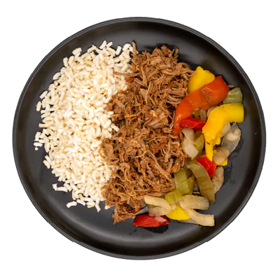 Shredded beef barbacoa with white rice, peppers, and onions on a black plate.