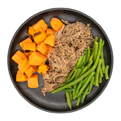 Shredded beef with green beans and roasted sweet potatoes on a black plate.
