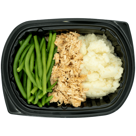 Pulled chicken with green beans and mashed potatoes in a black meal tray.