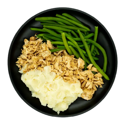 Pulled chicken with green beans and mashed potatoes on a black plate.