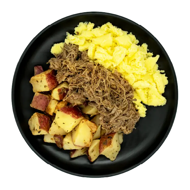 Shredded beef with scrambled eggs and roasted red potatoes on a black plate.