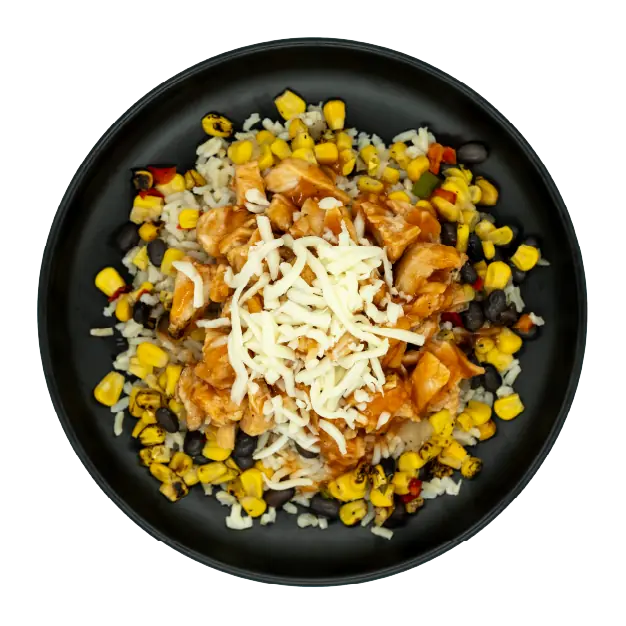 Diced chicken breast in sweet chili sauce with corn, black beans, and mozzarella cheese over brown rice on a black plate.