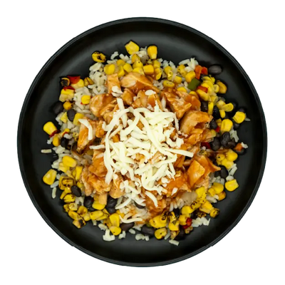 Diced chicken breast in sweet chili sauce with corn, black beans, and mozzarella cheese over brown rice on a black plate.