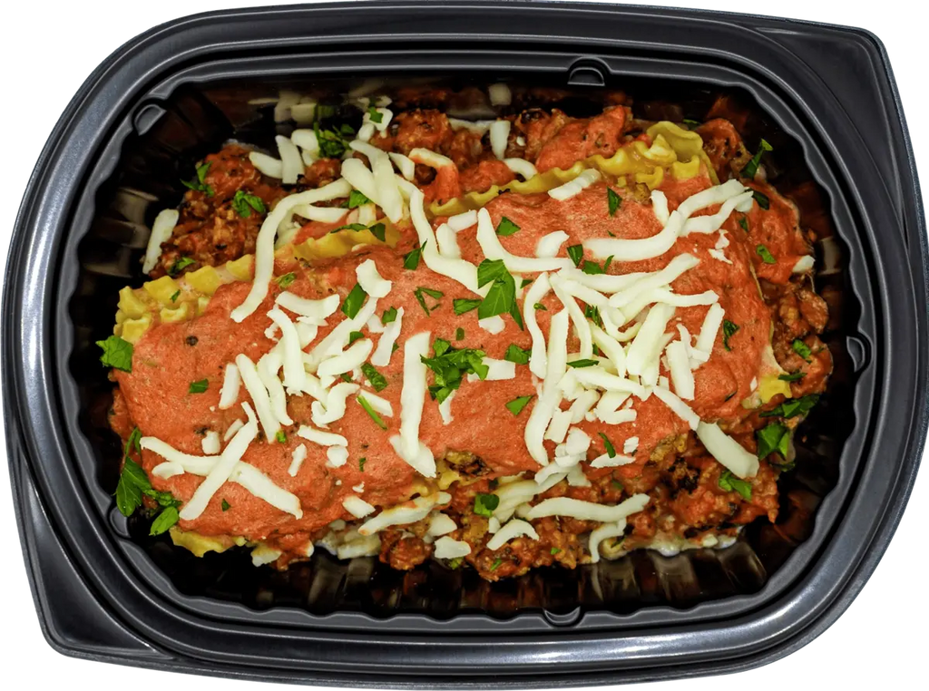 Healthy portioned tray with baked protein and crisp veggies