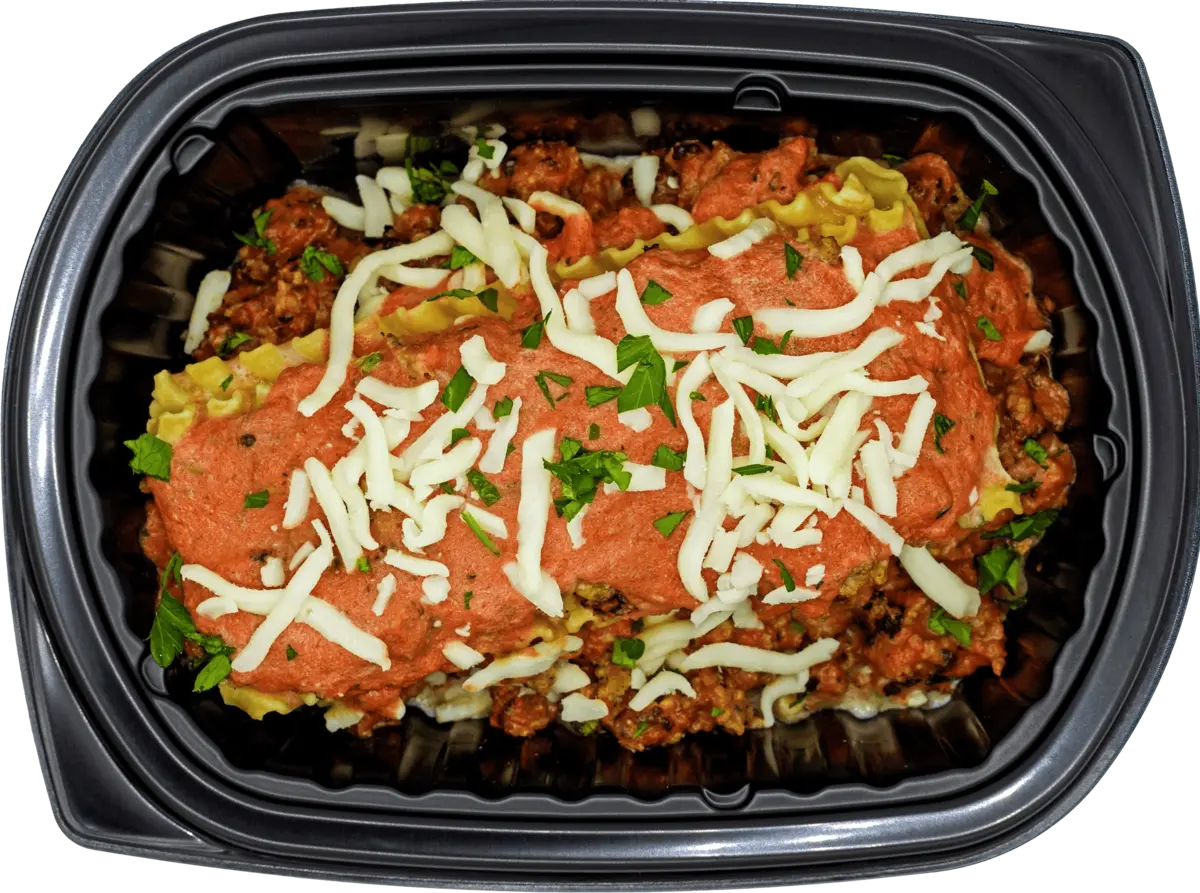 Healthy portioned tray with baked protein and crisp veggies
