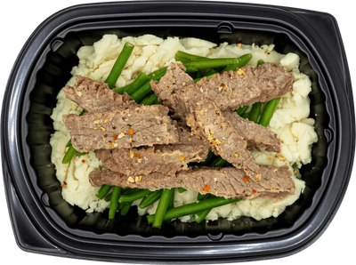 Well-balanced entree with glazed protein and steamed grains
