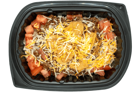 Cheeseburger bowl with seasoned beef, pickles, and melted cheese