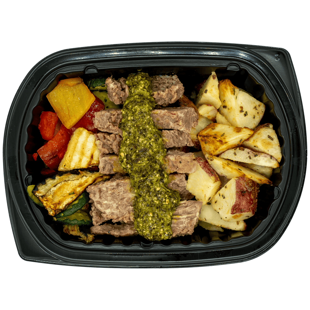 Chimichurri steak with fresh herb sauce and grilled vegetables