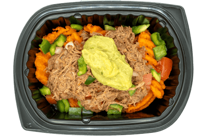 Good-for-you nachos topped with seasoned shredded meat, peppers, onions, and a dollop of guacamole in a black meal tray.