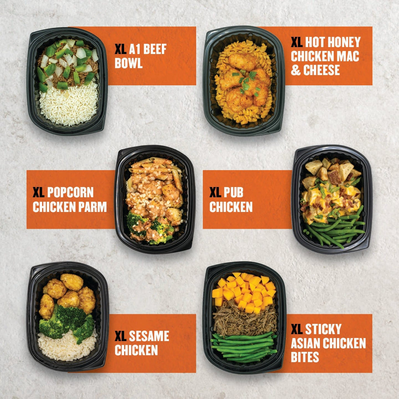 Clean Eatz Kitchen Extra Protein Box – six high-protein XL meal prep containers featuring XL A1 Beef Bowl, XL Hot Honey Chicken Mac & Cheese, XL Popcorn Chicken Parm, XL Pub Chicken, XL Sesame Chicken, and XL Sticky Asian Chicken Bites.
