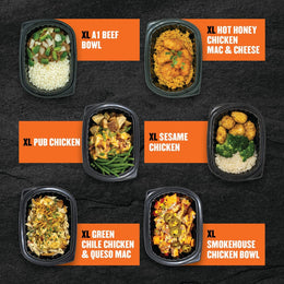 Extra-large Clean Eatz Kitchen meals for hearty appetites, featuring XL A1 Beef Bowl, XL Hot Honey Chicken Mac & Cheese, XL Pub Chicken, XL Sesame Chicken, XL Green Chile Chicken & Queso Mac, and XL Smokehouse Chicken Bowl—protein-packed frozen dinners designed for meal prep or high-volume nutrition.