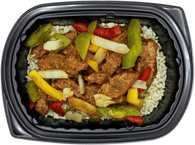 Steak strips with sautéed peppers and onions over brown rice in a black meal tray.