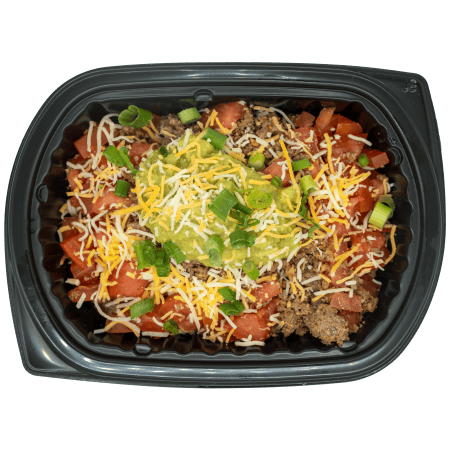 Burrito bowl topped with salsa, shredded cheese, guacamole, and green onions in a black meal tray.