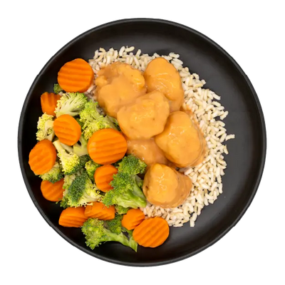 Tempura hibachi chicken with broccoli, carrots, and brown rice on a black plate.