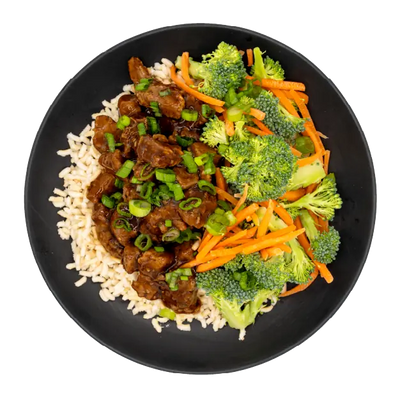 Teriyaki beef with broccoli, carrots, green onions, and brown rice on a black plate.