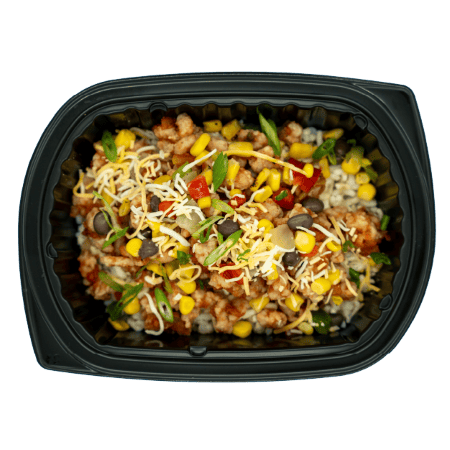 Chicken taco bowl with corn, peppers, shredded cheese, and green onions over brown rice in a black meal tray.