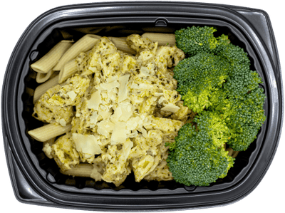 Chicken in a creamy pesto alfredo sauce over penne pasta with broccoli and shaved parmesan in a black meal tray.