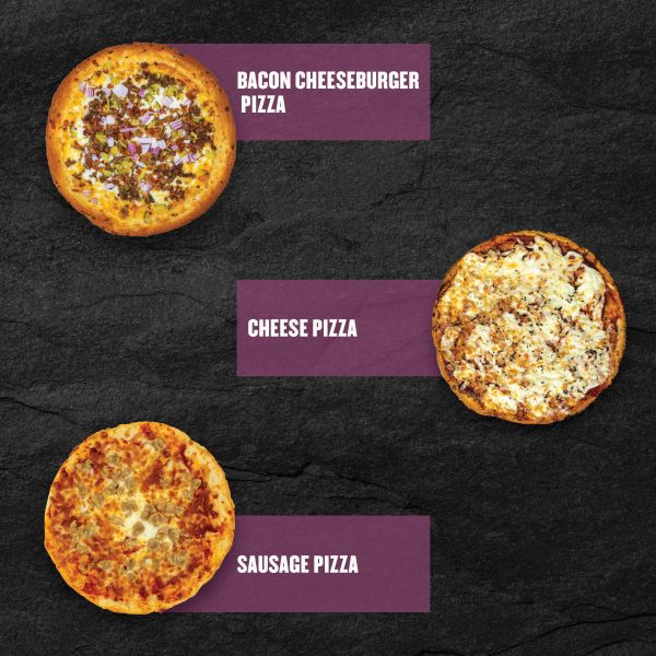 Three Clean Eatz Kitchen pizzas on a black stone background — Bacon Cheeseburger Pizza, Cheese Pizza, and Sausage Pizza — displayed with purple labels.