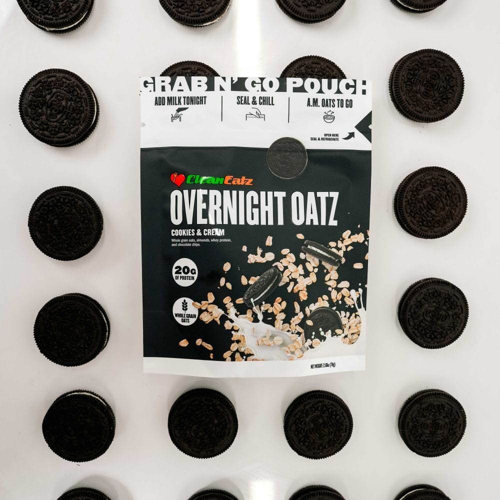 Clean Eatz Overnight Oatz Cookies & Cream flavor pouch surrounded by chocolate sandwich cookies – protein-packed overnight oats with whole grains