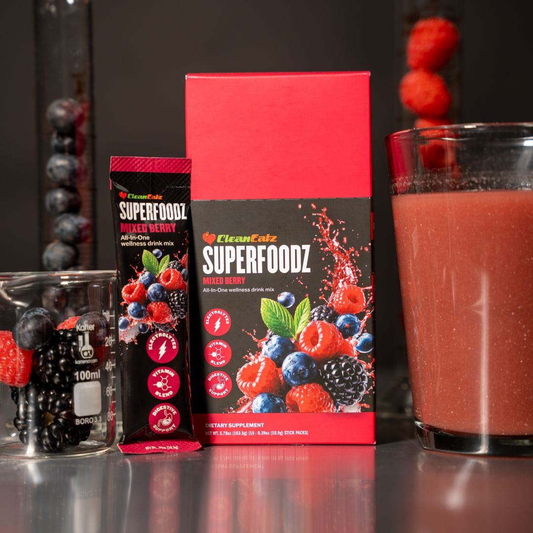 Superfoodz mixed berry drink mix packaging with a glass of juice and berries on a dark background