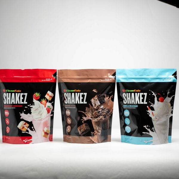 Three packages of Clean Eatz SHAKEZ with different flavors on a white background