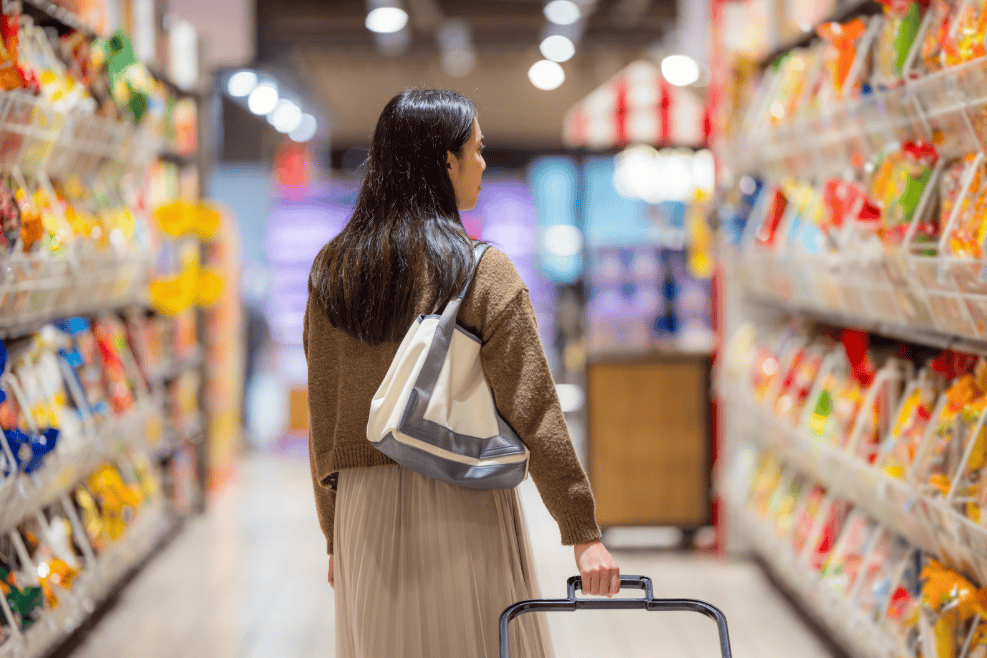woman grocery shopping in grocery store